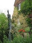 Bespoke sculpture amongst bed of mixed grasses